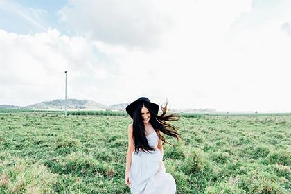 What does a mole below the left eyebrow tail of a woman signify? What is the meaning of a red mole on a woman's chest?